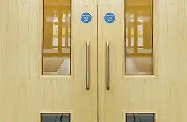 Fire doors with keep shut sign